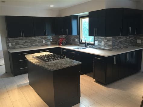 Modern Kitchen With Ebony Cabinet And Glass Tile Backsplash Kitchen