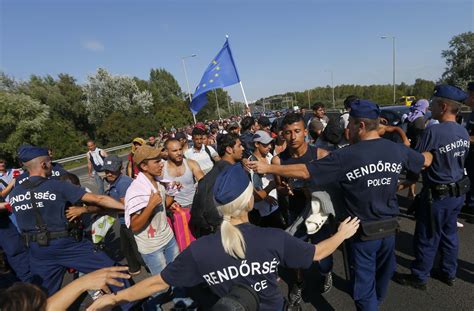 Migrant Crisis Hundreds March From Budapest To Border As Hungary Introduces Emergency Law
