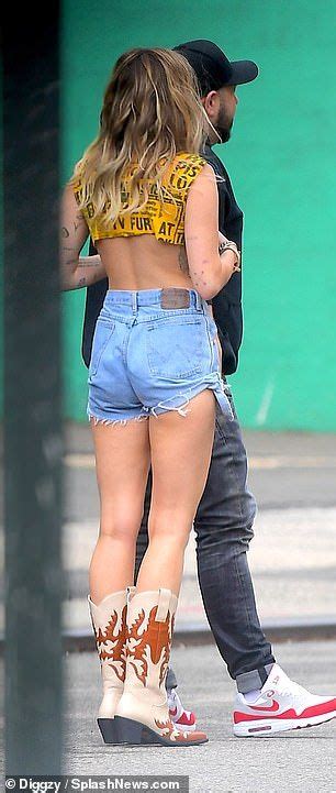 miley cyrus flashes her abs in a crop top and tiny daisy dukes for she is coming photoshoot