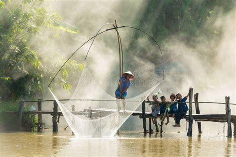 Rural Man Fishing By Fishing Net While Group Of Rural Children