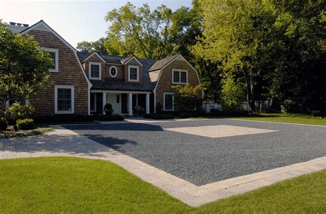Bluestone Chip Driveway Courtyard Bordered With Tumbled Concrete Pavers