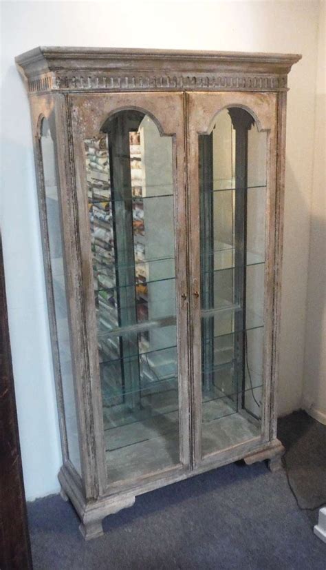 Made of veneers, wood and engineered wood. French Distressed Antique Decorative Display Cabinet at ...