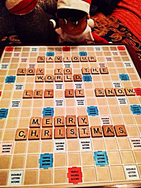 A Board Game With Letters And Words On It Including Santas Helper Hat