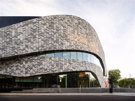 Tiled Facade Wraps Curved Convention Centre By Woods Bagot And Warren