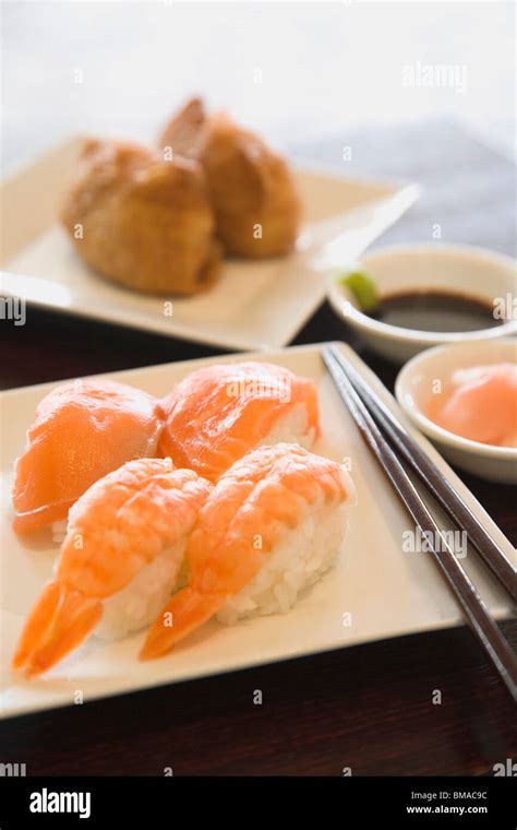 Sushi With Chopsticks Stock Photo Alamy