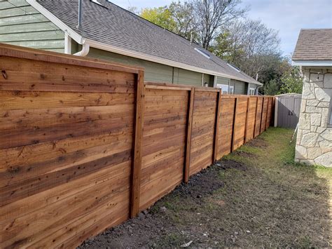 This fence has a size that is not. Horizontal Wood Fence Designs | Austin Fence Builders