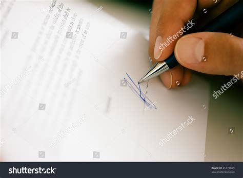 Man Only Hand To Be Seen Signing A Contract Or Another Document Fake