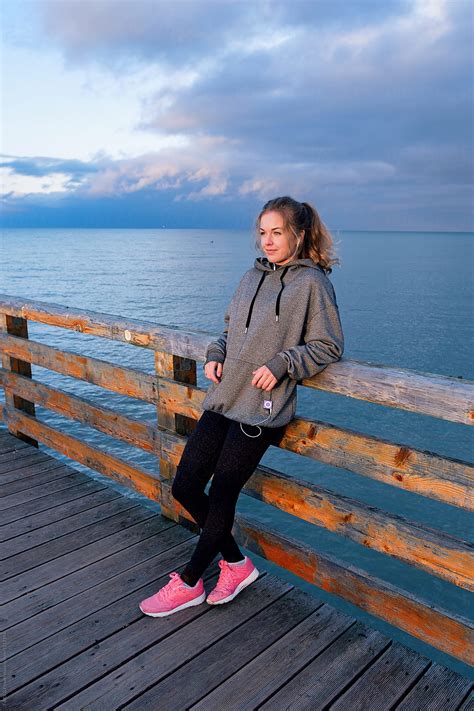 Female Athlete On Pier By Stocksy Contributor Danil Nevsky Stocksy