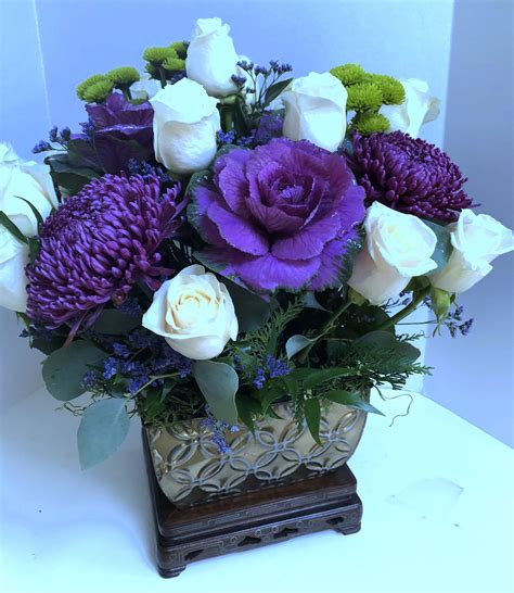 Robust Purple Flowers And White Roses Adorn This Embossed Copper Tone