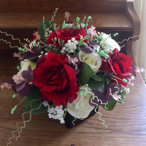 A Large Flower Arrangement Of Red And Ivory Roses Abigailrose