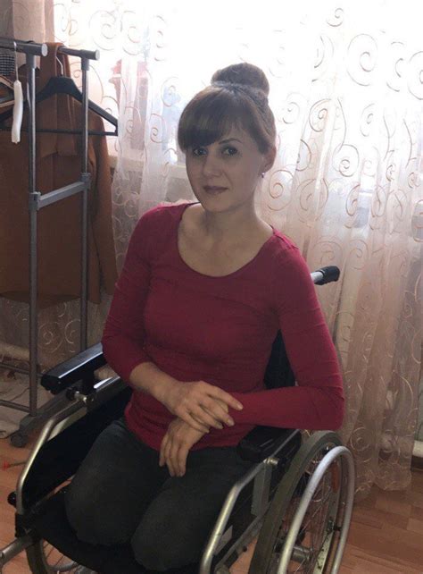 A Woman In A Wheel Chair Posing For The Camera