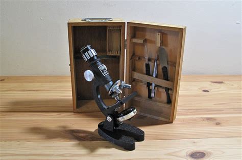 A Microscope In A Wooden Box On A Table