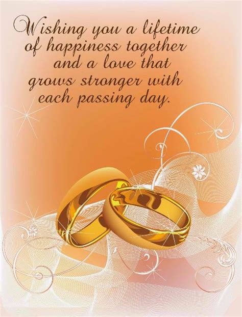 Two Gold Wedding Rings With The Words Wishing You A Lifetime Of Happiness Together And A Love