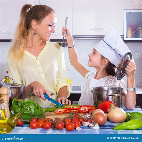 Girl Helping Mother To Prepare Stock Photo Image Of House Girl 70449742