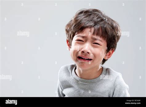 Close Up Shot Of A Boy Crying Stock Photo Alamy