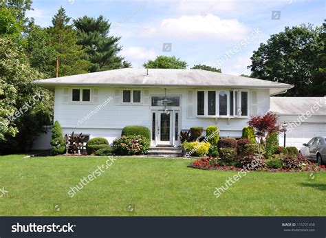 Suburban High Ranch Style Home Landscaped Stock Photo 115721458
