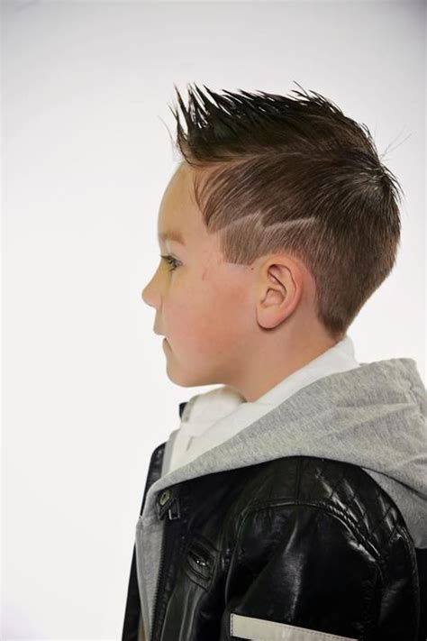 Boys haircut with lightning bolt design. faded fohawk with lightening bolt carving | Hair designs ...