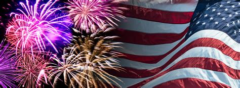 Celebration fireworks over american flag background. American Flag Waving For A National Holiday With Fireworks Stock Photo - Download Image Now - iStock