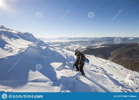 Tourist Hiker Climber In Winter Clothing With Backpack Climbing
