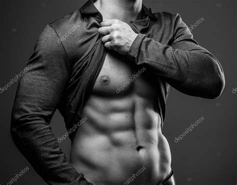 Fashionable Guy With Muscular Body Posing Stock Photo By ©fxquadro 68916005