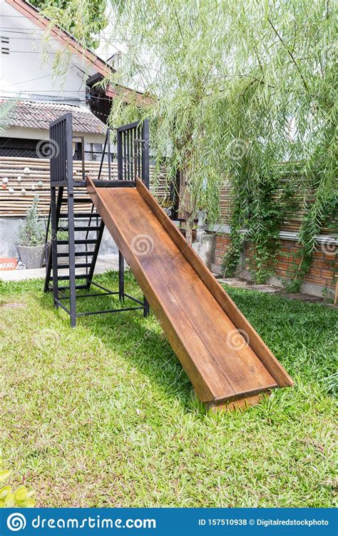 Playground Wooden Slide In The Garden Stock Photo Image Of Swing