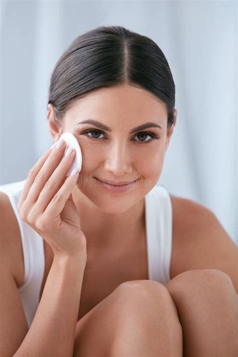 Woman Cleaning Face With Cosmetic Cotton Pad Removing Makeup Stock