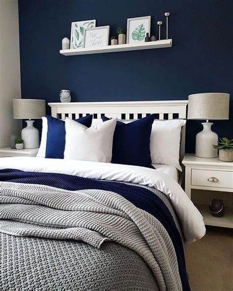 A Cozy Bedroom Done In Navy White And Greys Looks Contrasting Bold