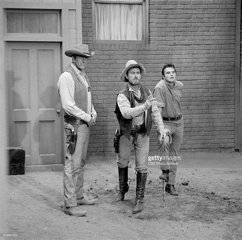 James Arness as Matt Dillon, Ken Curtis as Festus Haggen and Burt