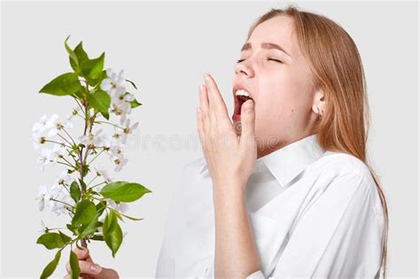 Allergy Symptoms Displeased Young Woman Uses Tissue Sneezes All Time Stands Near Blossom