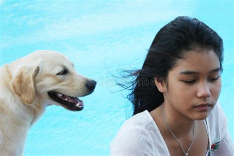 Asian Girl With Her Pet Dog Focus Is On The Girl Stock Image Image