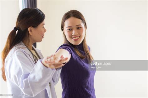 Female Doctor Helped Her Patient Do Physiology High Res Stock Photo