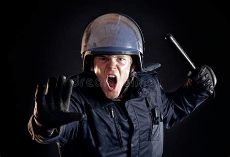 Angry Police Officer Telling Violent Crowd To Stop Stock Image Image