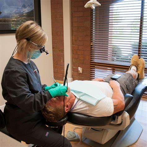Dental Hygienist Prepares Patient For Periodontal Treatment At Torghele
