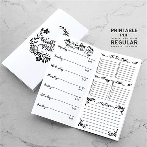 The Printable Planner Is Open On Top Of A Marble Surface With Flowers