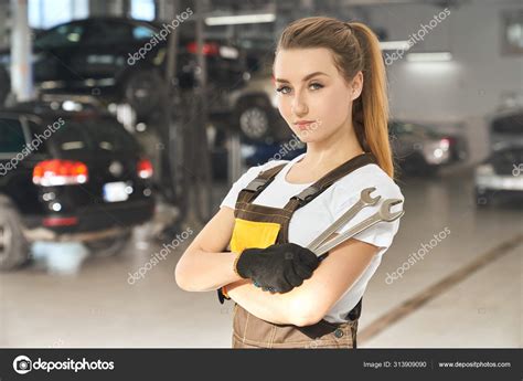Beautiful Female Mechanic Posing Holding Wrenches Stock Photo By