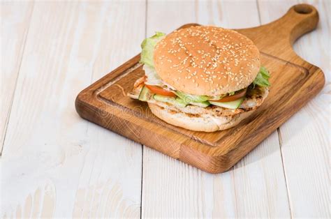 tasty burger   wooden background copyspace stock image image  food horizontal