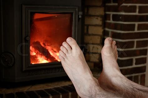 Two Male Naked Feet Warming Up In Front Stock Image Colourbox