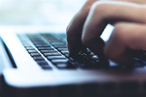 Person Typing On Keyboard Free Stock Photo Iso Republic