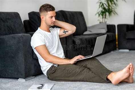 Guy Freelancer With Laptop Working At Home Stock Photo Image Of