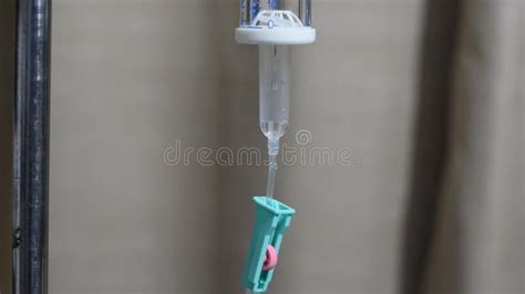 Iv Infusion Set And Bottle On A Pole Liquid Saline Is Slowly Dripping