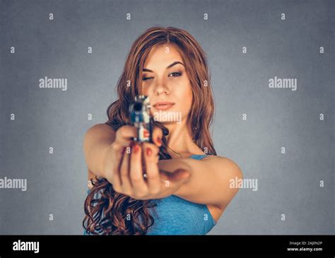 A Hand Holding Gun And Pointing It At Camera Hi Res Stock Photography