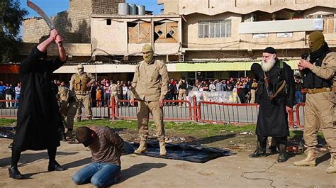 Blindfolded Men Are Beheaded By ISIS Executioner In Iraq Daily Mail