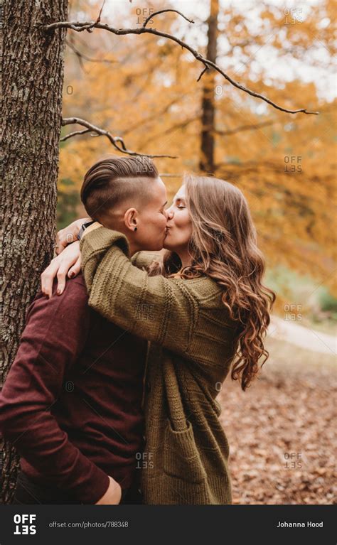 Couple Kissing In The Forest Stock Photo Offset
