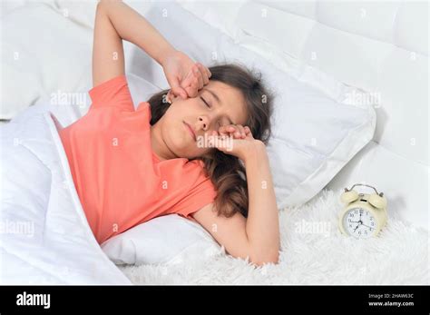 Cute Little Girl Waking Up In Bed Stock Photo Alamy