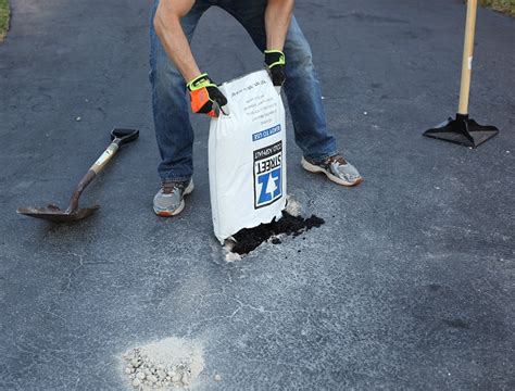 I've found that using a gas powered leaf blower significantly improves how well you can clean. Do it yourself pothole driveway repair with EZ Street cold asphalt