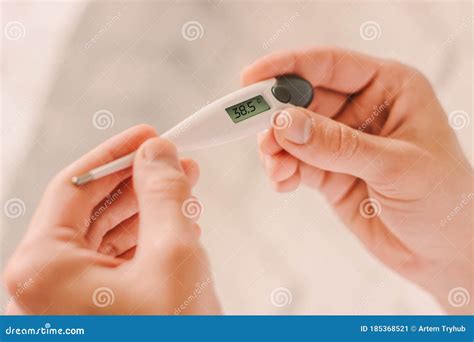 Man Holding Digital Thermometer With High Fever Body Temperature Stock