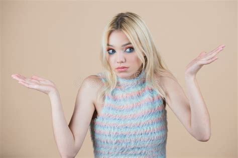 Confused Beautiful Blonde Woman With Questioning Gesture Girl