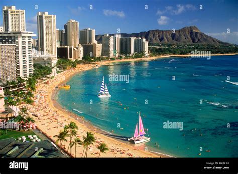 Waikiki Beach And Diamond Head With Beach Front Hotels And Catamarans