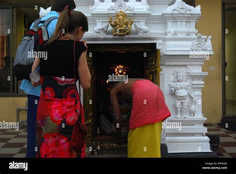 Praying At A Hindu Temple Stock Photo Alamy