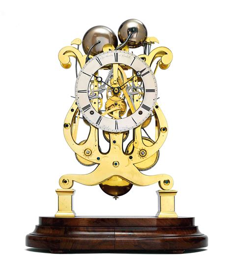 A VICTORIAN BRASS QUARTER-CHIMING EIGHT DAY SKELETON CLOCK , THOMAS COX